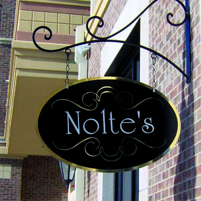 Design Tip: Use sign brackets that accentuate the shape of your sign.